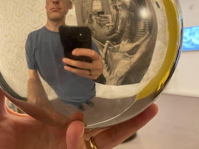 Interactive space with a hanging reflection ball.