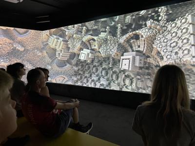 Kids watching a video.